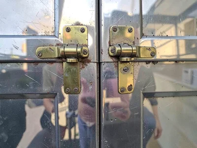 Brass hinges on old door