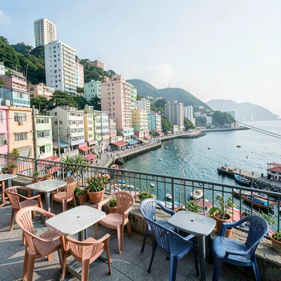 Busan vertical density, hillside village stacking, seafood restaurant with harbo