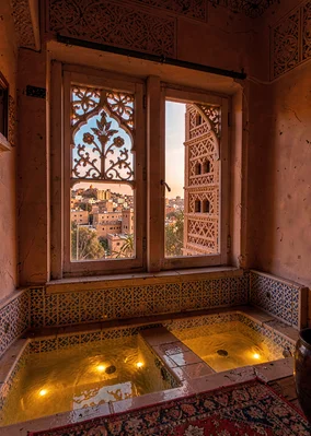 Colored light through qamariya windows in Sana'a, Yemen, carved alabaster window