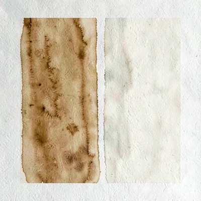 Two vertical color-blocks meet center-frame in deep ochre and pale ivory, the se