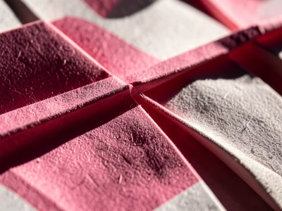 Origami cherry blossom branch made from pink and white paper, macro detail