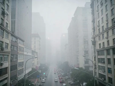 Urban canyon in smog filling