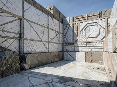 Extraction block shadows creating strong geometric rhythm