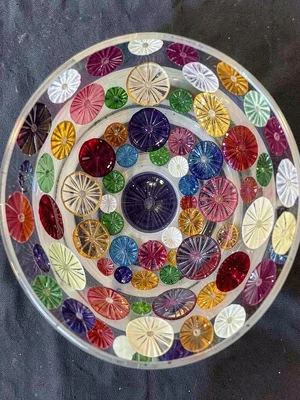 Millefiori bowl interior — scattered flower cane slices fused into curved surfac