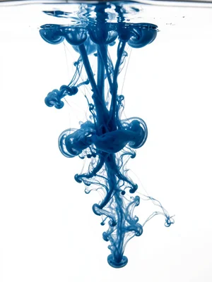 Ink in glycerin, slowed diffusion creating elongated tendrils that hang suspende