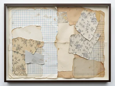 Torn wallpaper scraps layered over torn graph paper, pattern fragments meeting m
