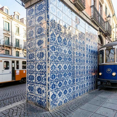 Azulejo tile geometry, Portuguese ceramic culture, A tram car passing a wall of 