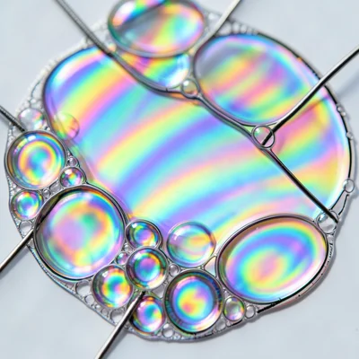 Cluster of soap bubbles, each sphere showing different interference colors based