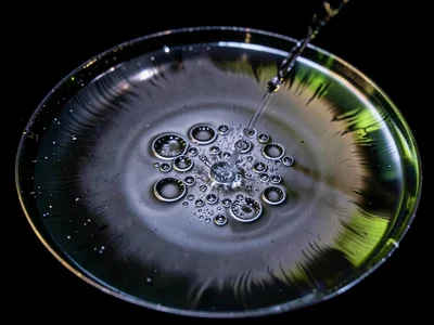 Liquid surface showing the moment of droplet coalescence from vibration