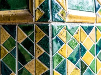 Green and gold tiles in architectural context