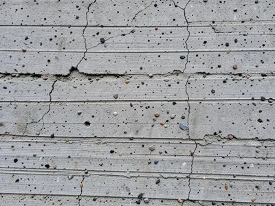 Board-formed concrete wall, wood grain texture imprinted from formwork, horizont
