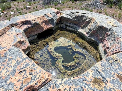 Weathering pit holding rainwater pool