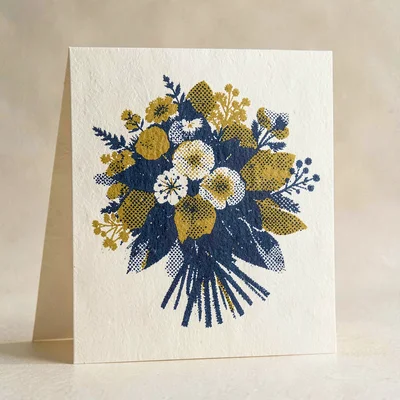 Bold riso poster of a folded card with halftone bouquet motif in indigo and must