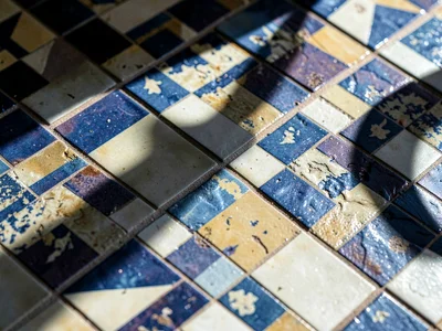 Shadow of window falling across tile pattern