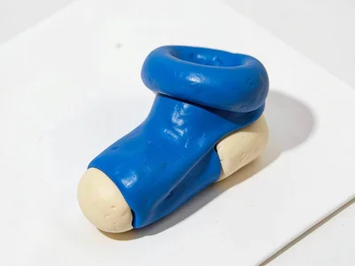 Cozy chunky clay sock in primary blue with stubby cream-toned heel and oversized