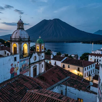 Colonial color against volcano in Granada, Nicaragua, Rooftop view of colonial G