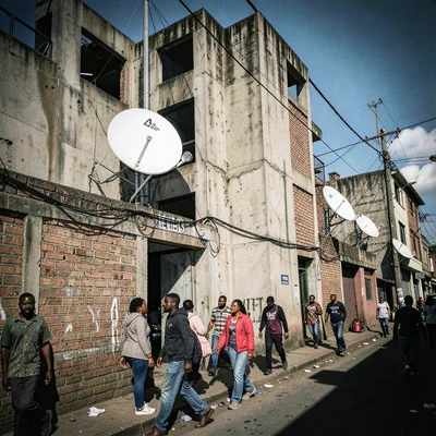 Post-industrial Johannesburg brutalism with harsh flash, Kasi street scene with 