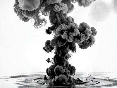 Ink cloud rising against gravity from bottom