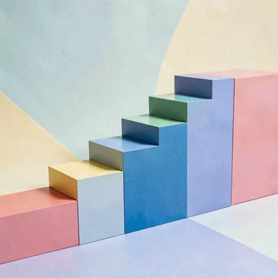 Color-block scene of paint chip cards arranged in a stepped staircase shape