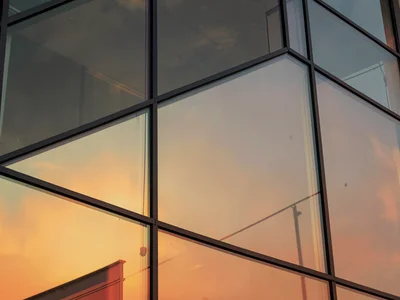 Glass catching last light as warm amber