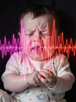 Crying baby shown as sharp pink and red chaotic waveforms