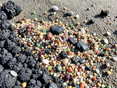 Sand from different beaches mixed showing origin