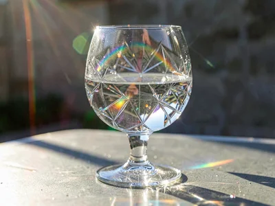 Rainbow caustic from drinking glass in afternoon sun