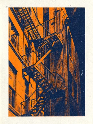 A fire escape zigzagging down a building in fluorescent orange and dark blue
