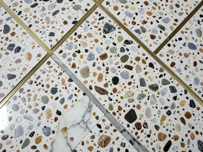 Architectural terrazzo: large sections of different marbles creating a geometric