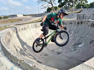BMX rider in concrete bowl