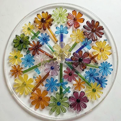 Millefiori platter overhead — large flat work with scattered flower cane pattern
