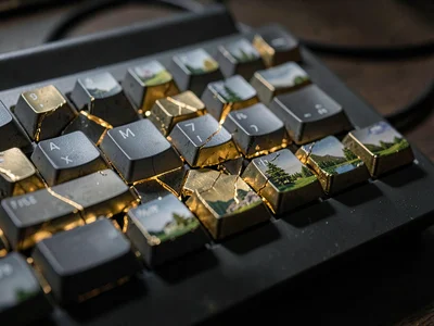 Shattered mechanical keyboard with brass filling the gaps between broken keycaps