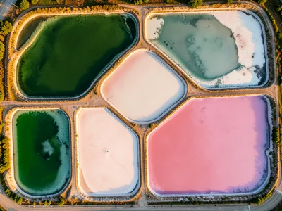 Salt evaporation ponds in varying concentrations, each pool a different color fr