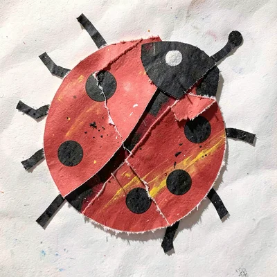 Paper collage ladybug with spots