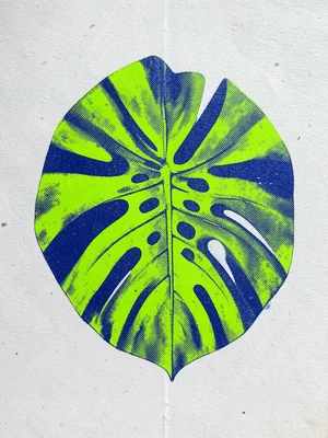 A large monstera leaf printed in fluorescent green with deep blue shadows, halft