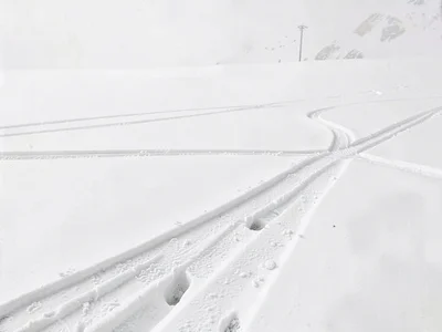 Ski tracks crossing otherwise perfect white
