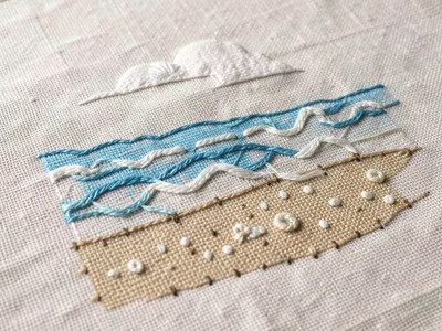 Embroidered summer beach scene on linen, satin stitch waves, french knot sand