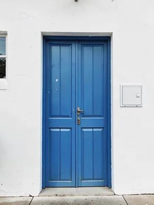 Blue door white wall