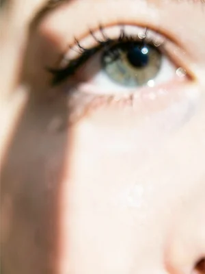 Eye close-up with catchlight, rest falling away