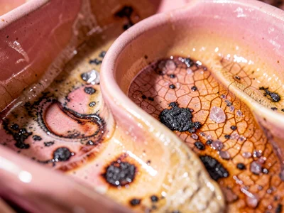 Set of handmade ceramic bowls in graduating warm pinks, gift arrangement