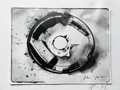 Monoprint made by pressing found objects into fresh ink on plate, circular and a