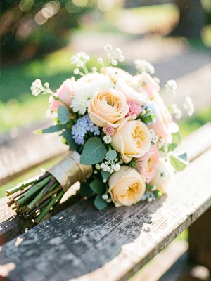 Wedding bouquet on a wooden bench