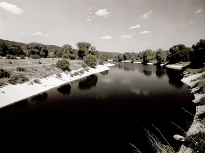 River with white banks dark water
