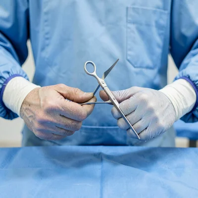 Butcher's hands and surgeon's hands, same gesture different context, centered an