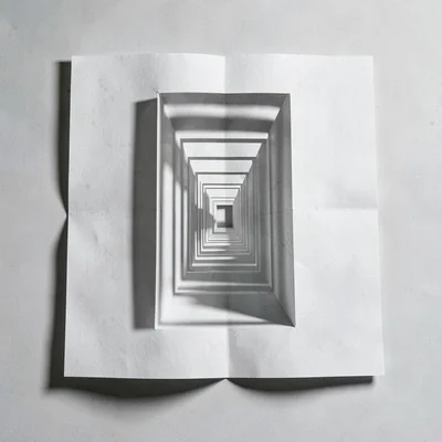 Inside spread of a paper labyrinth folded from a single sheet, narrow corridors