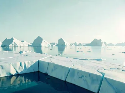 A long line of icebergs forms a horizon stripe, each subtly different in shape a