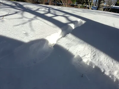 Window light creating path on snow