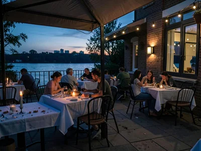 Restaurant patio being cleared, Sunday family dinner remnants, candles extinguis