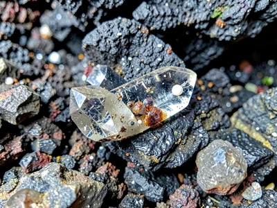 Volcanic glass with rare phenocryst inclusions