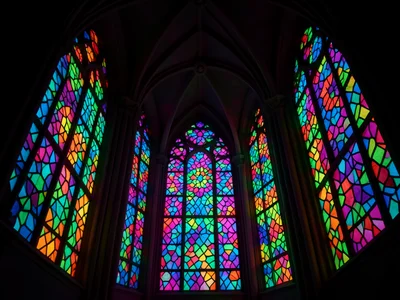 Voronoi pattern in glass, each cell a different color, backlit, cathedral-like